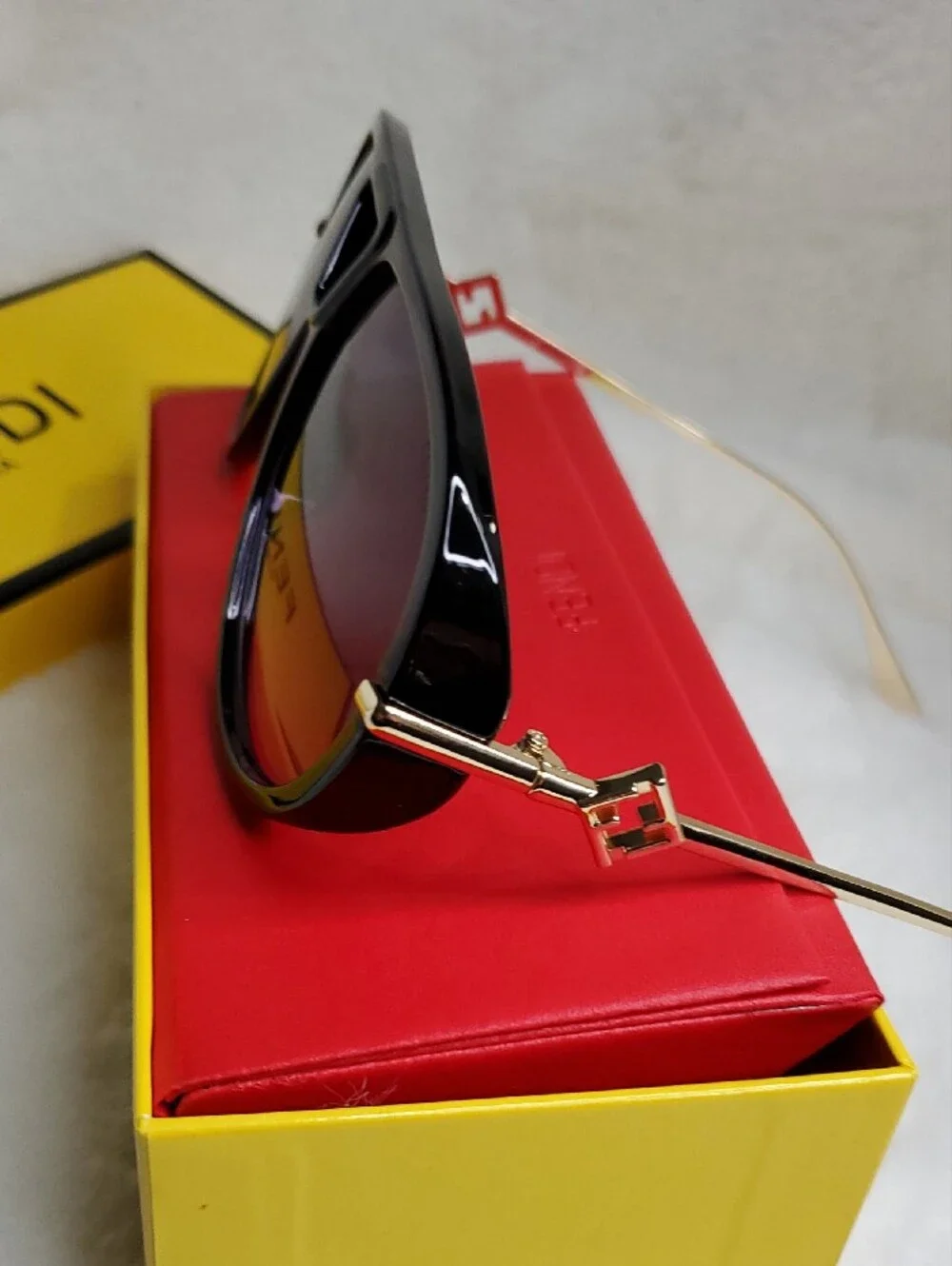 F Black and Gold Rimless Sunglasses